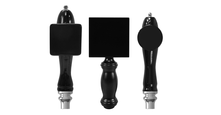 black beer tap handles with a plate